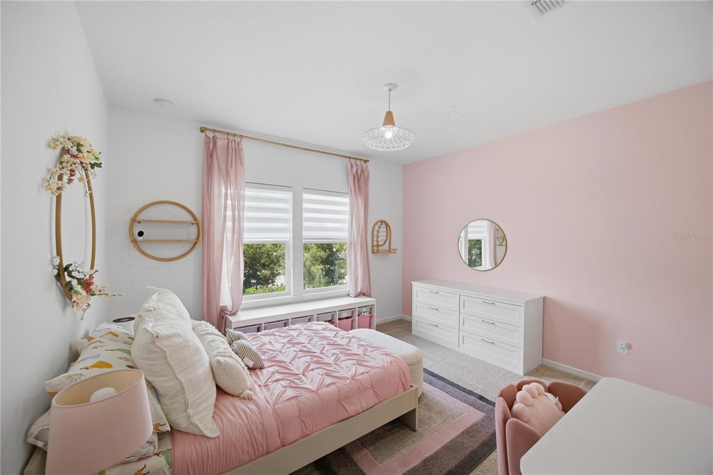 13816 Sharp Hawk Drive Riverview, FL 33569 - Photo 48 of 76 a bedroom with a bed and a window