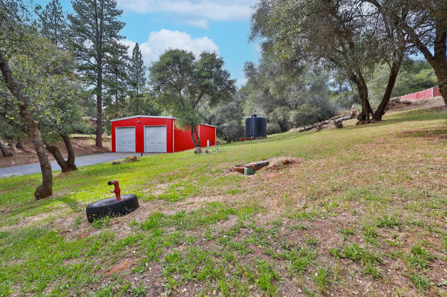 4773 Jacarah Road Placerville, CA 95667 - Photo 62 of 94 Workshop/office building has it's own electric submeter, propane tank and watwr storage tank.