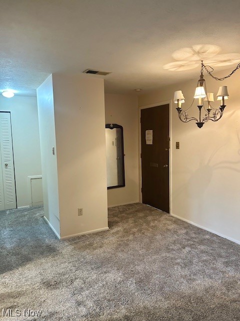 3068 Kent Road, Unit 211 Stow, OH 44224 - Photo 8 of 27 Empty room with carpet, a chandelier, and baseboards