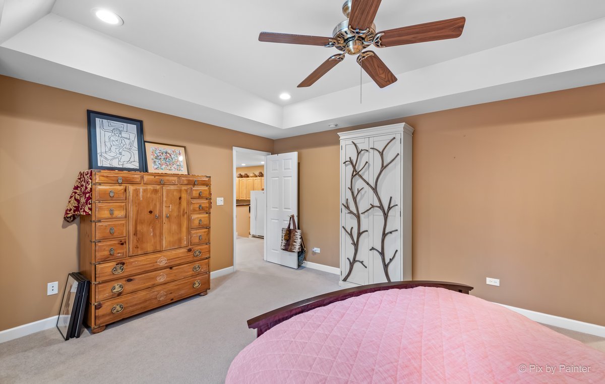 1 Renaissance Place, Unit GF7 Palatine, IL 60067 - Photo 12 of 28 a bedroom with a bed and a ceiling fan