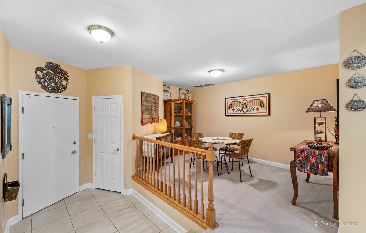1 Renaissance Place, Unit GF7 Palatine, IL 60067 - Photo 3 of 28 a view of a dining room and hall with furniture