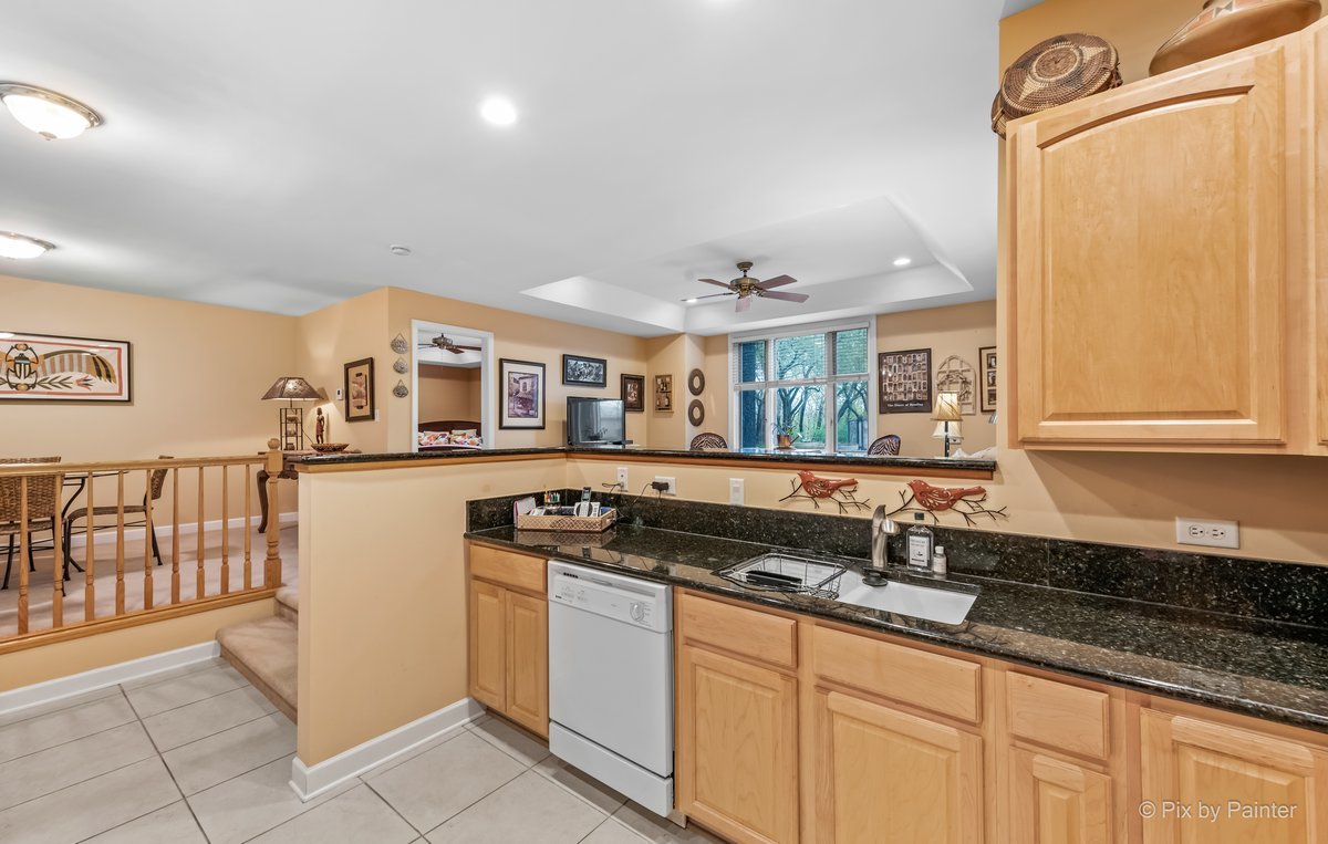 1 Renaissance Place, Unit GF7 Palatine, IL 60067 - Photo 4 of 28 a kitchen with granite countertop a sink and a stove