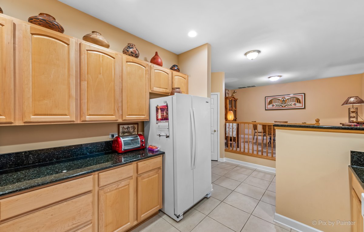 1 Renaissance Place, Unit GF7 Palatine, IL 60067 - Photo 6 of 28 a kitchen with stainless steel appliances granite countertop a refrigerator and a sink