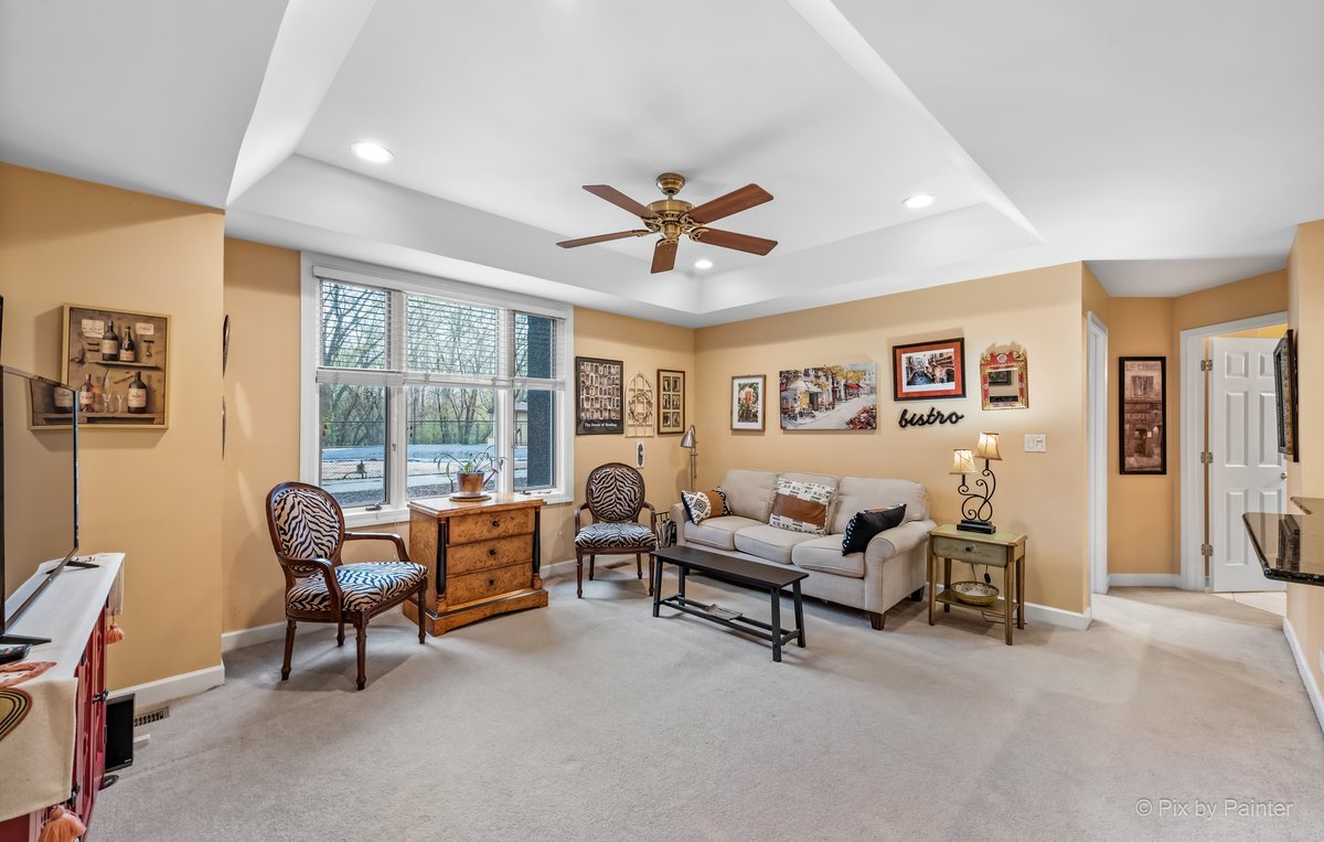 1 Renaissance Place, Unit GF7 Palatine, IL 60067 - Photo 10 of 28 a living room with furniture and a ceiling fan
