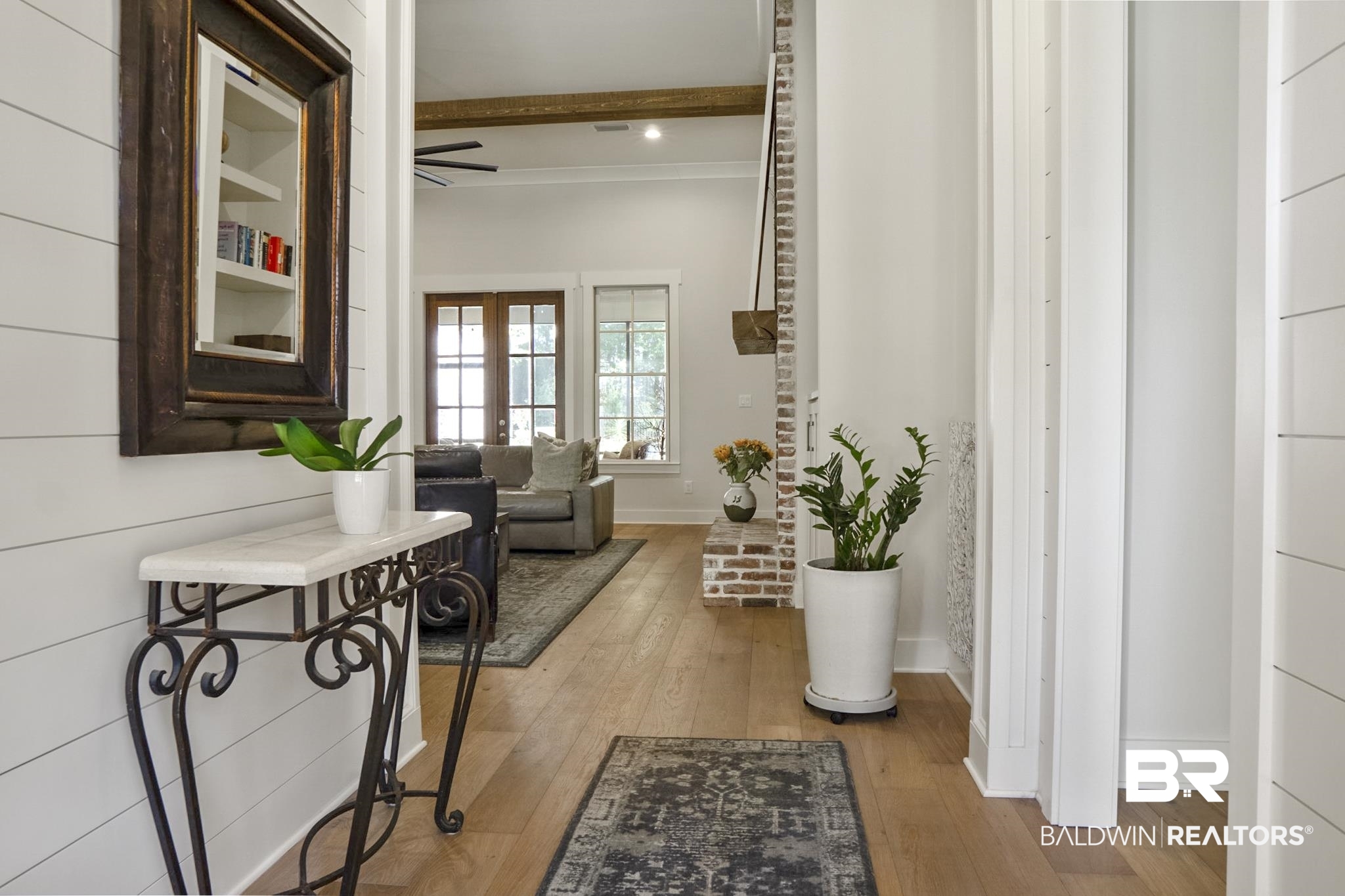 11258 Redfern Road Daphne, AL 36526 - Photo 6 of 44 Corridor with light wood-style floors, beam ceiling, and french doors