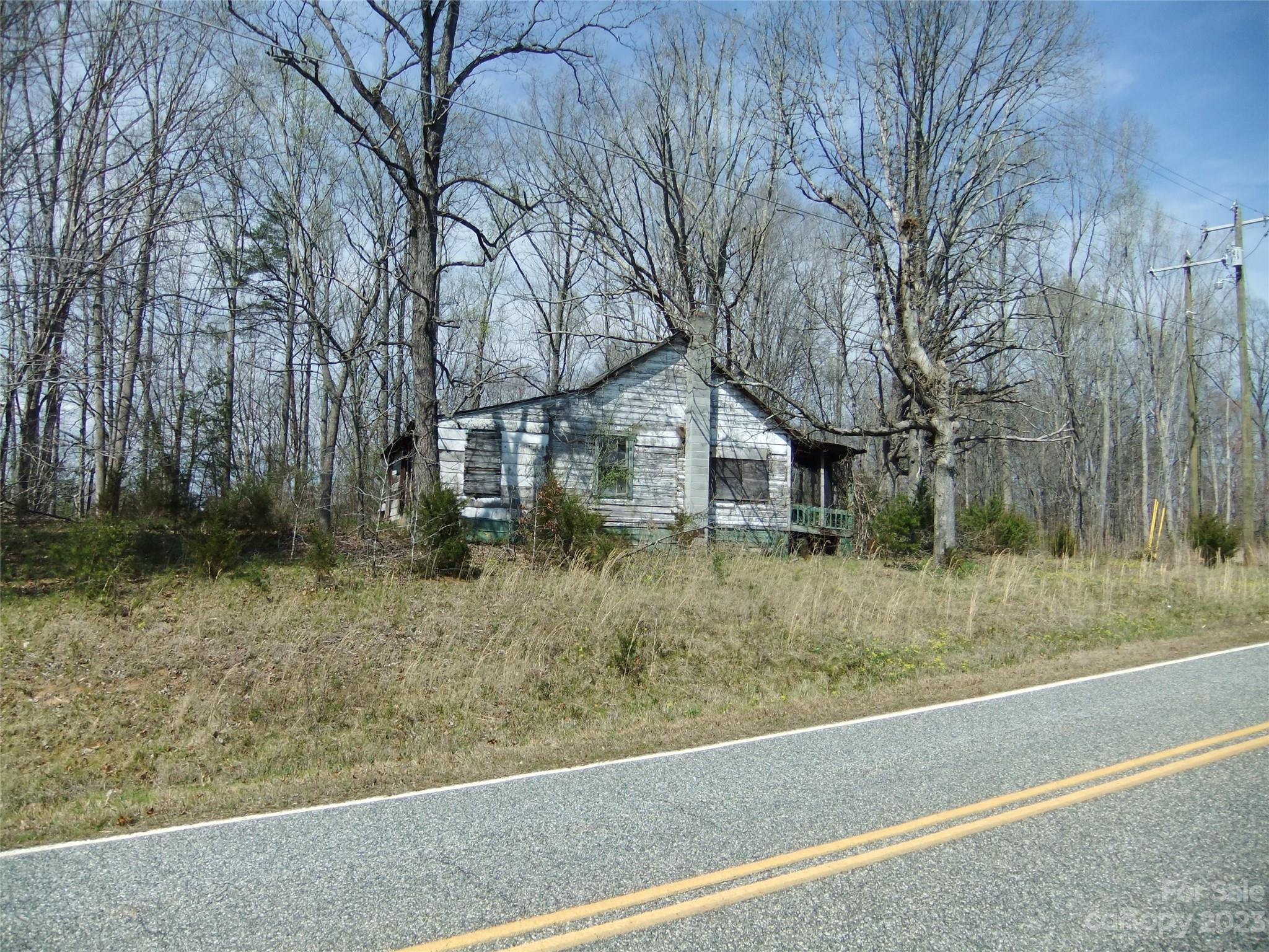 182 Roper Loop Road Rutherfordton, NC 28139 - Photo 5 of 42 a view of a house with a yard