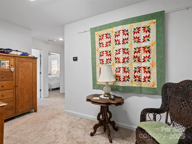 a view of a livingroom with furniture and window