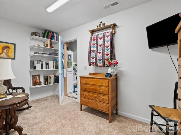 a living room with furniture and flat screen tv