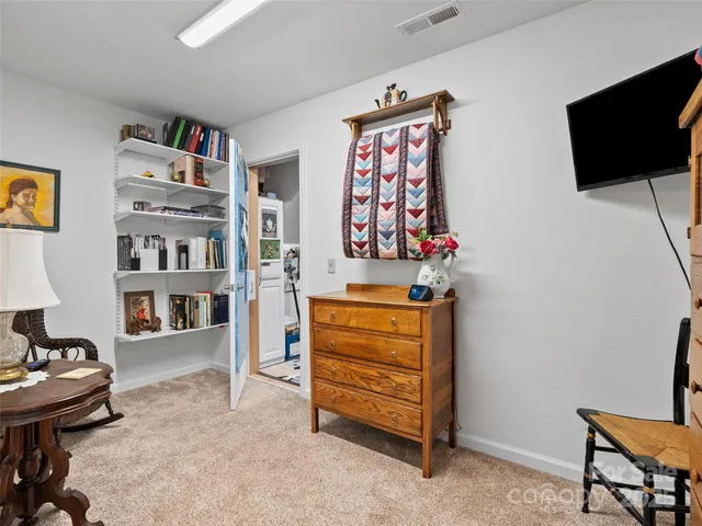 a living room with furniture and flat screen tv