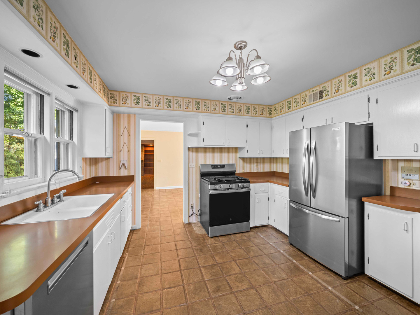 1125 Golfview Road Glenview, IL 60025 - Photo 14 of 44 a large kitchen with cabinets and stainless steel appliances