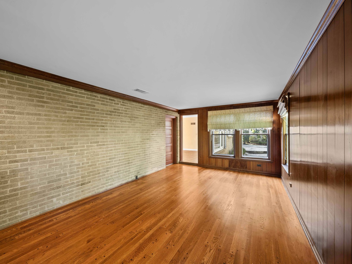 1125 Golfview Road Glenview, IL 60025 - Photo 18 of 44 a view of an empty room with wooden floor and a window