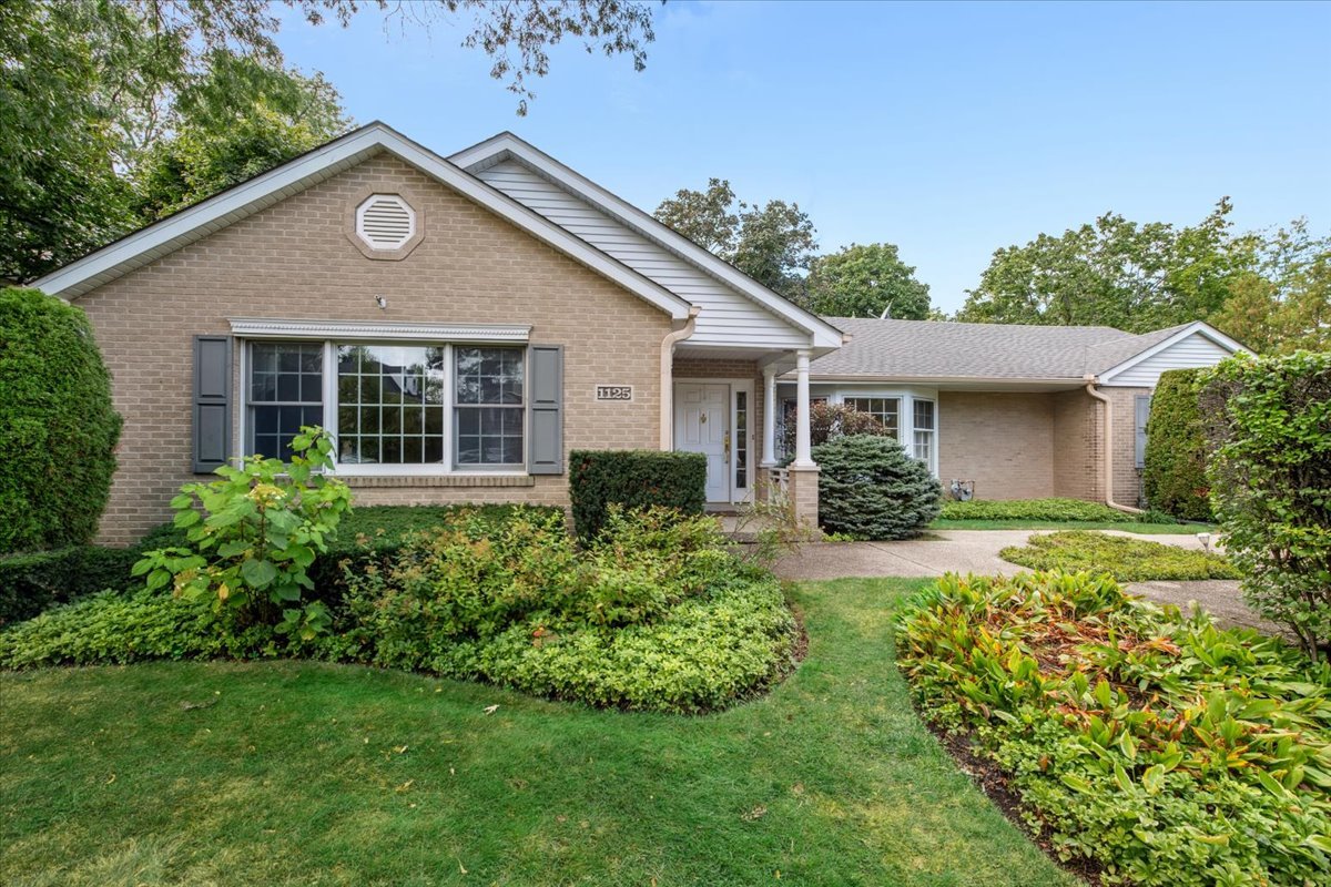 1125 Golfview Road Glenview, IL 60025 - Photo 2 of 44 a front view of a house with a yard
