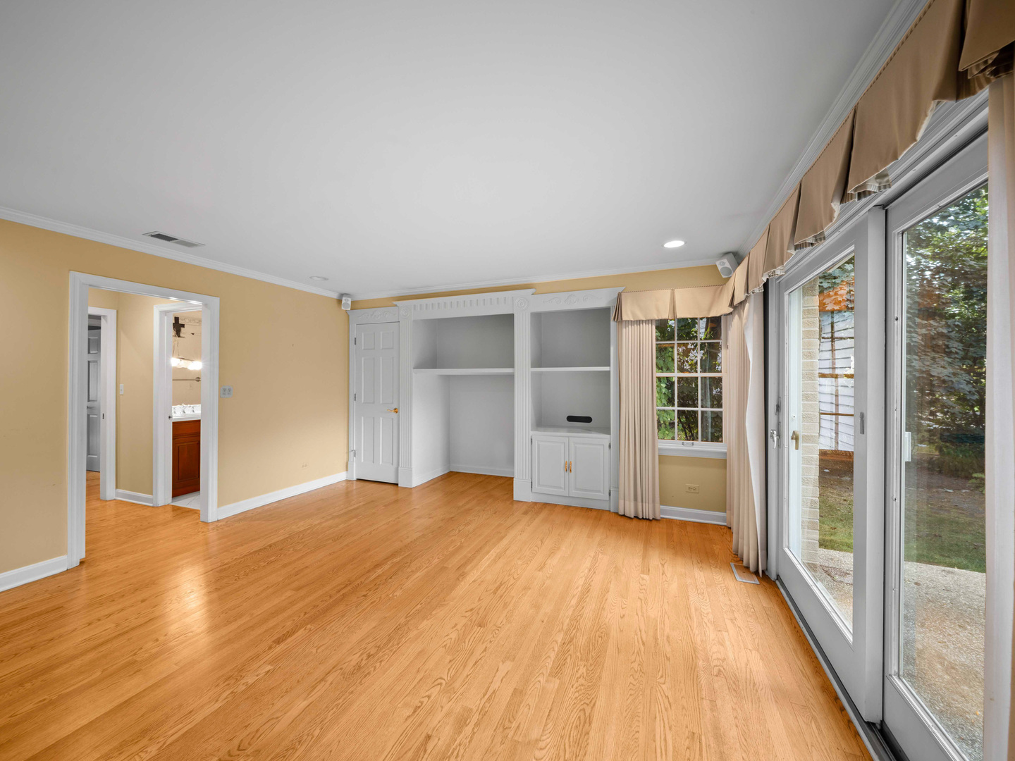 1125 Golfview Road Glenview, IL 60025 - Photo 29 of 44 a view of an empty room with wooden floor and a window