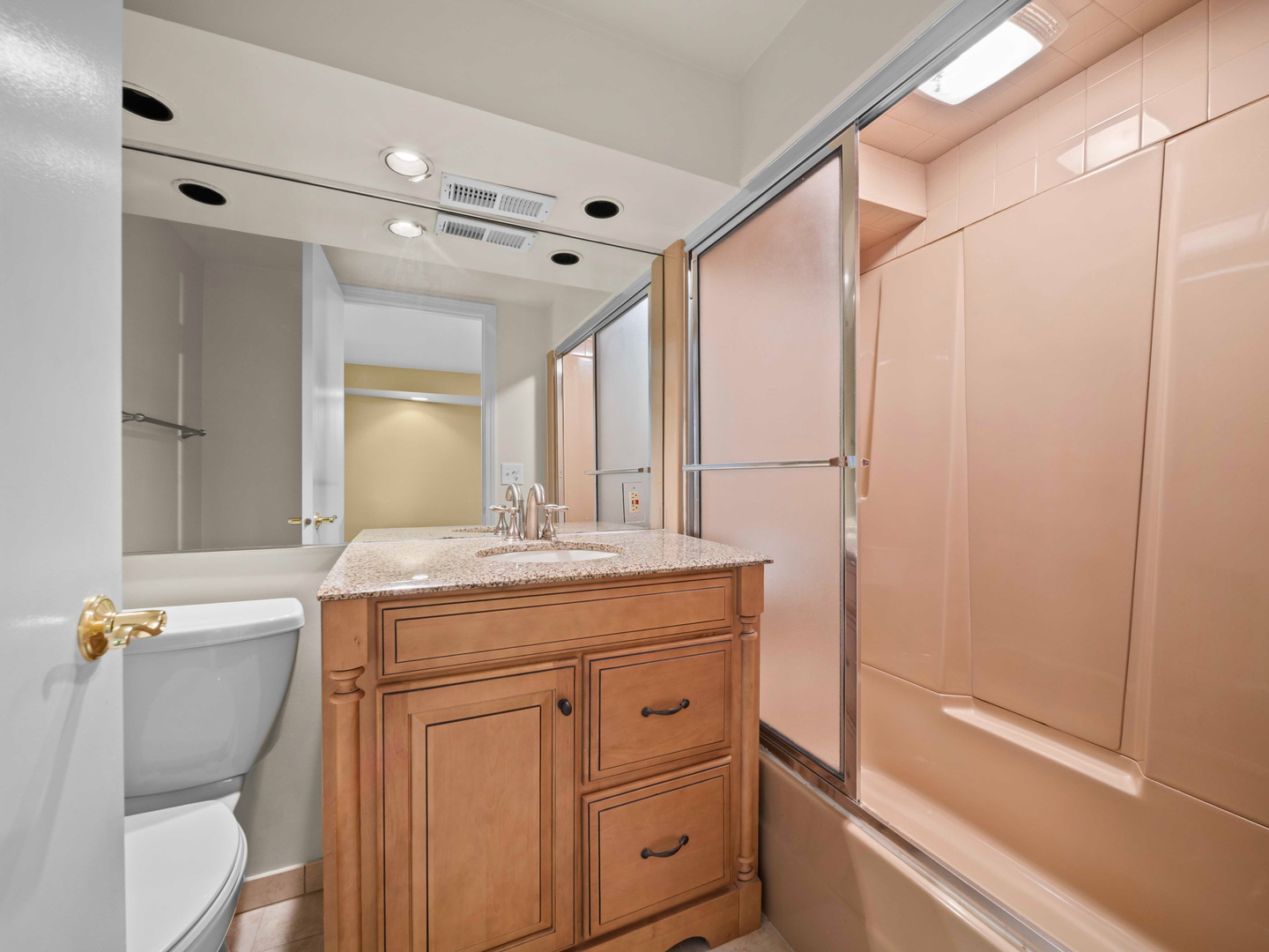 1125 Golfview Road Glenview, IL 60025 - Photo 38 of 44 a bathroom with a granite countertop sink a mirror and a shower