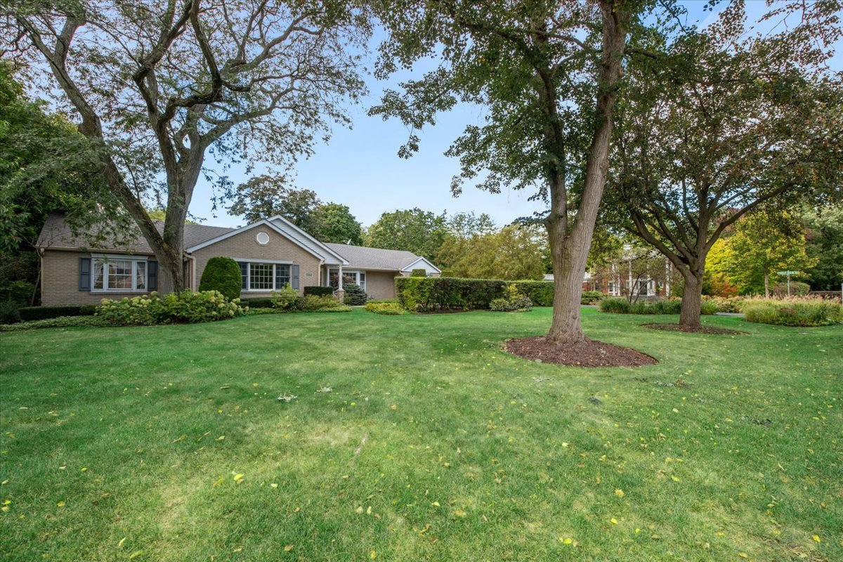 1125 Golfview Road Glenview, IL 60025 - Photo 5 of 44 a front view of a house with garden