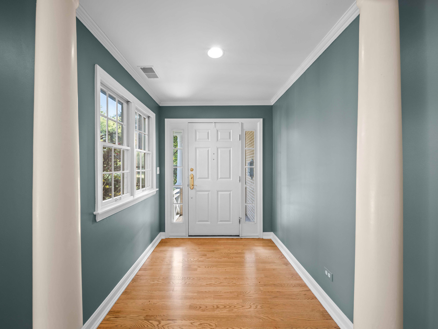 1125 Golfview Road Glenview, IL 60025 - Photo 7 of 44 a view of an empty room with wooden floor and a window