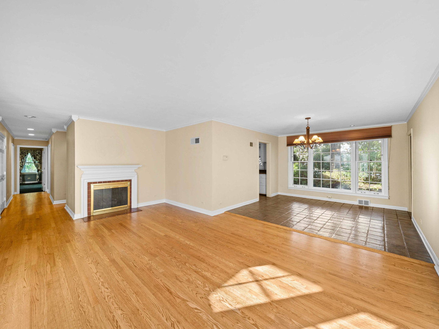 1125 Golfview Road Glenview, IL 60025 - Photo 8 of 44 a view of empty room with wooden floor and fireplace