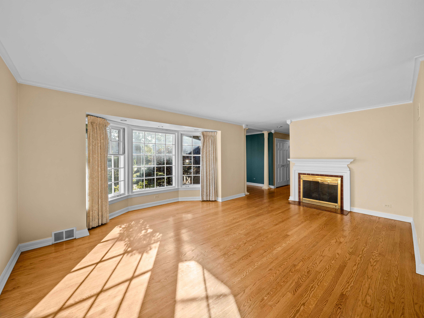 1125 Golfview Road Glenview, IL 60025 - Photo 9 of 44 a view of an empty room with a window and wooden floor