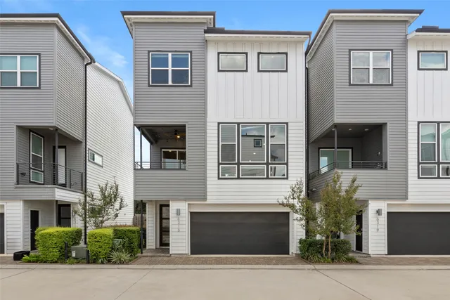 a front view of a house with garage