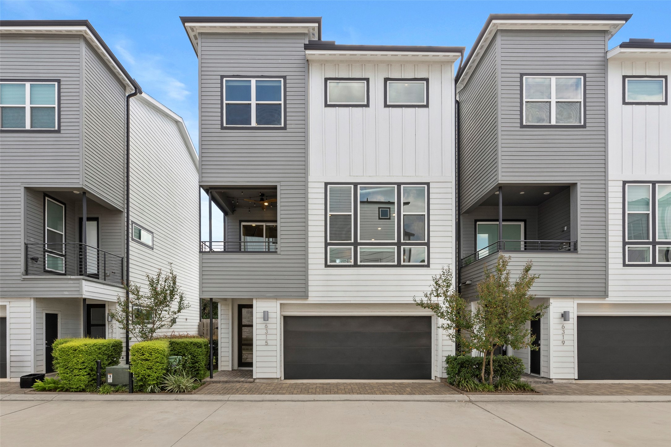a front view of a house with garage