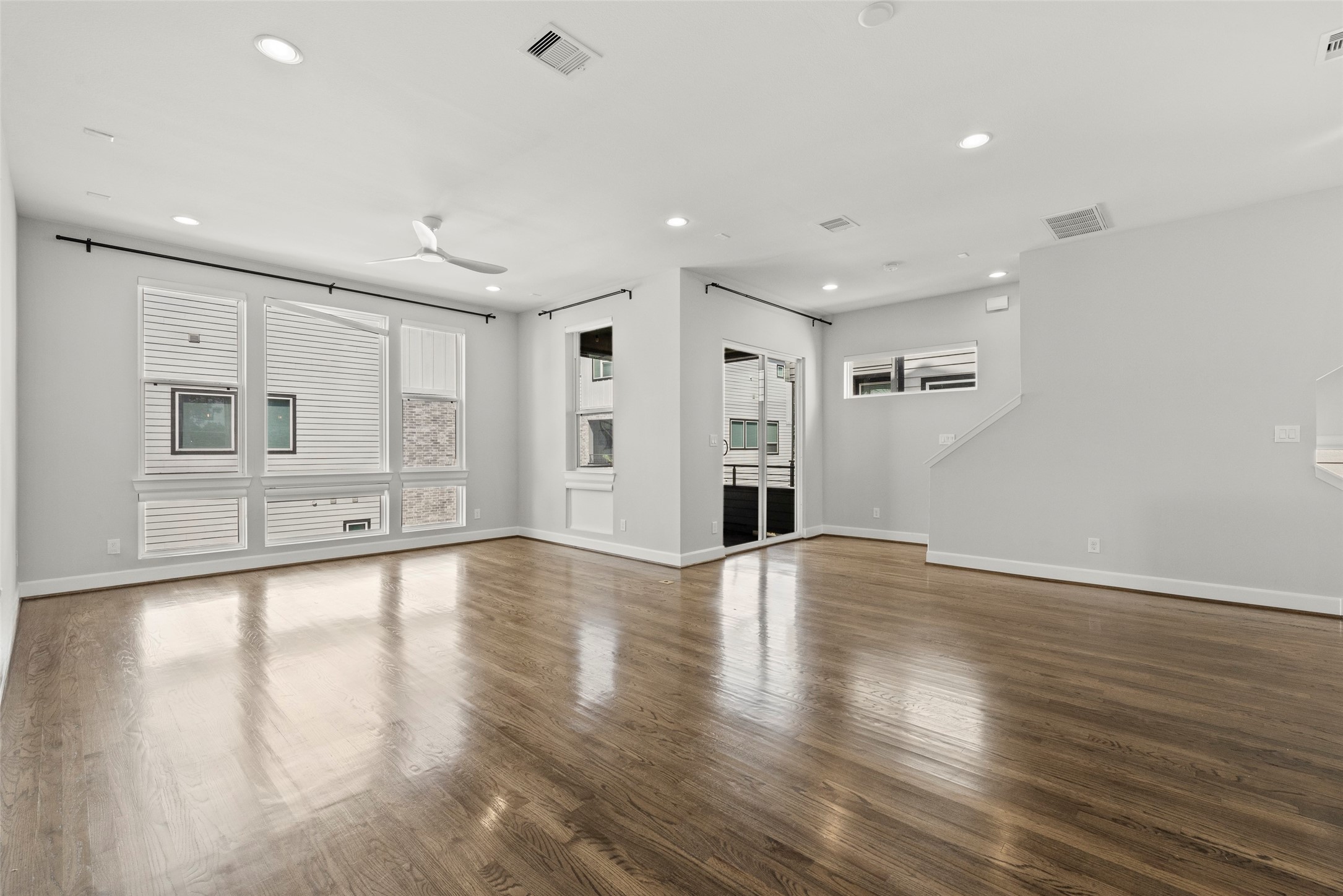 6315 Timbergrove Gardens Lane Houston, TX 77008 - Photo 15 of 33 a view of an empty room with window and wooden floor