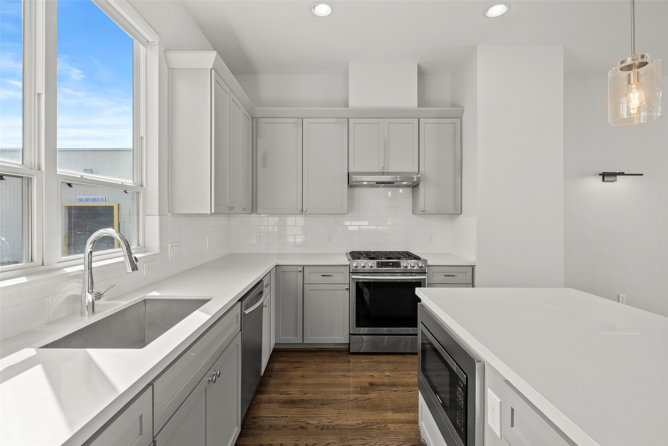 6315 Timbergrove Gardens Lane Houston, TX 77008 - Photo 19 of 33 a kitchen with a sink stove and cabinets