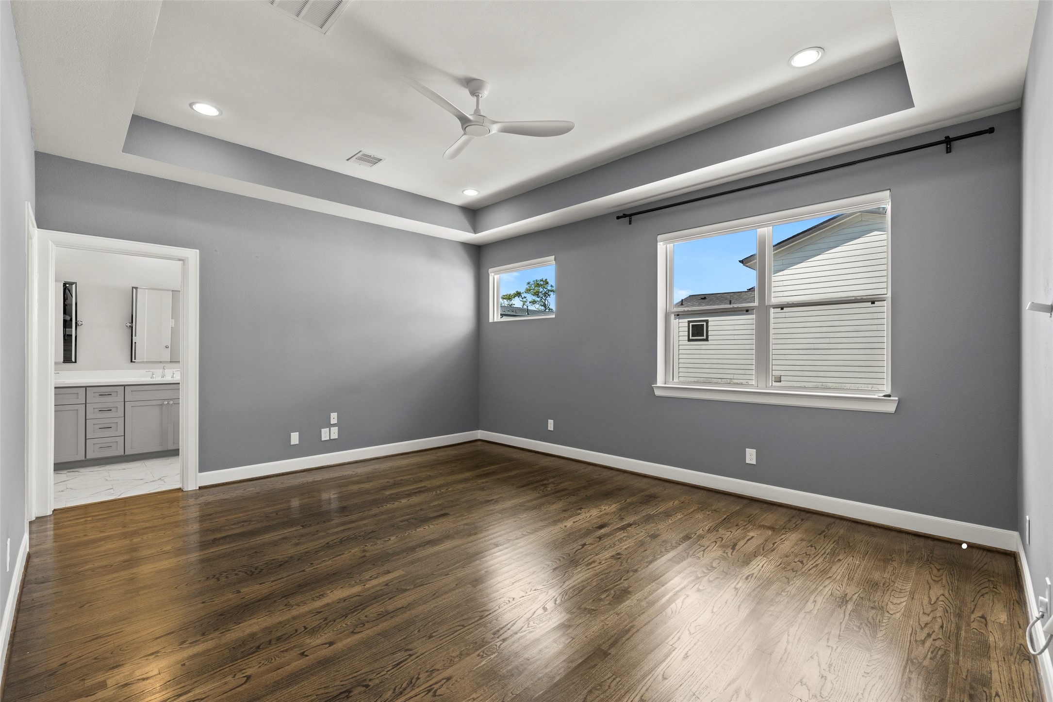 6315 Timbergrove Gardens Lane Houston, TX 77008 - Photo 26 of 33 a view of an empty room with wooden floor and a window