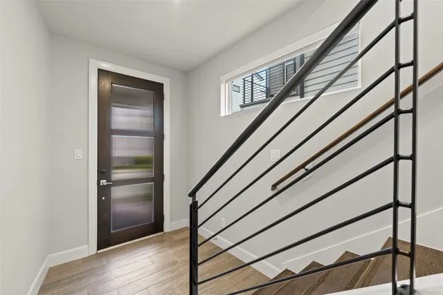 a view of entryway with wooden floor