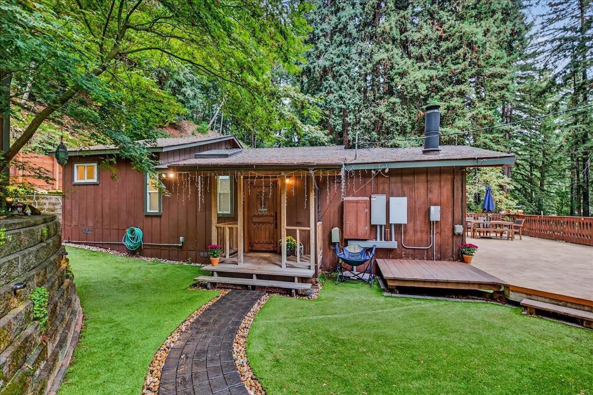 a view of a house with backyard porch and sitting area