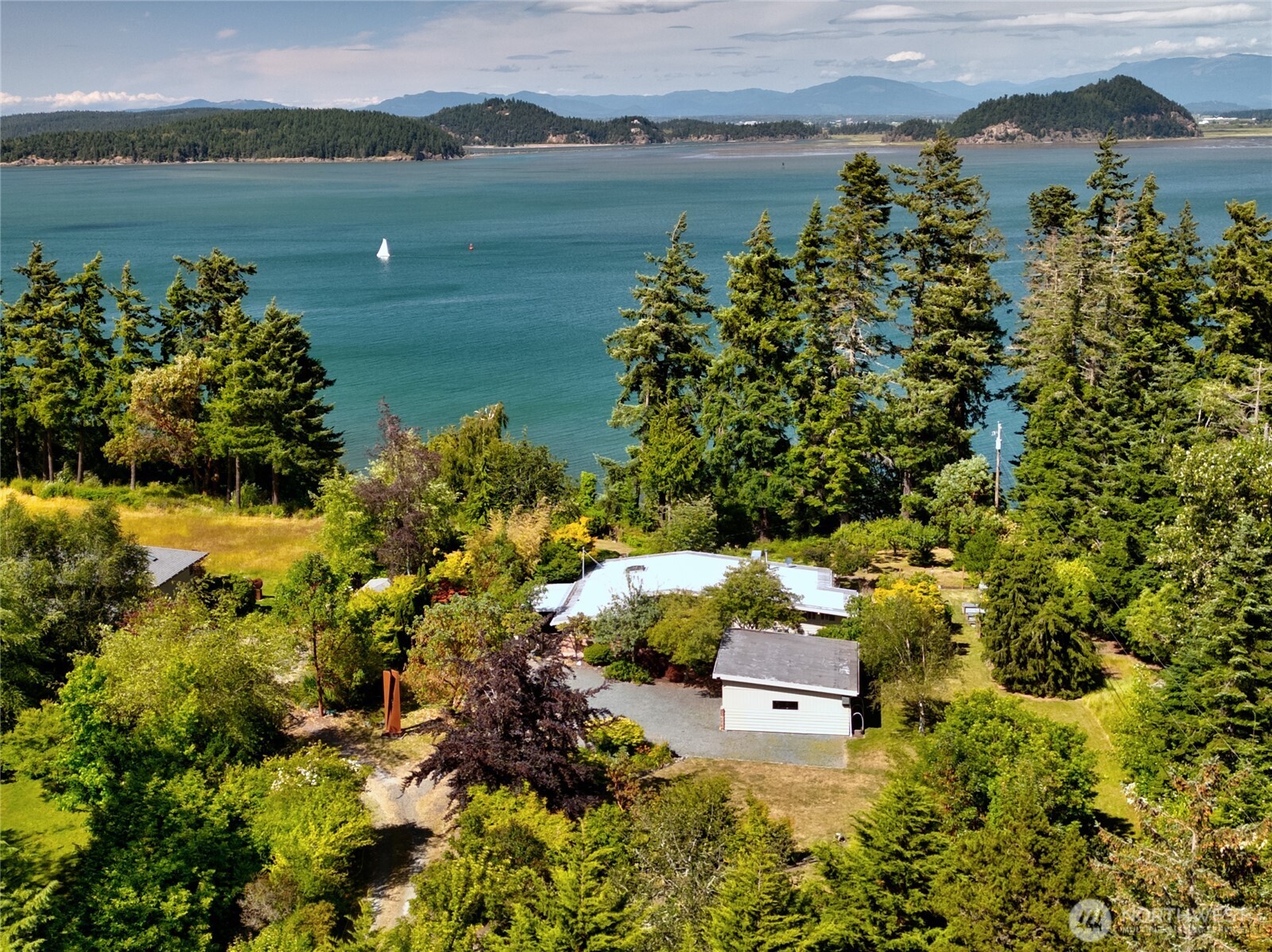 a aerial view of a house with a lake view