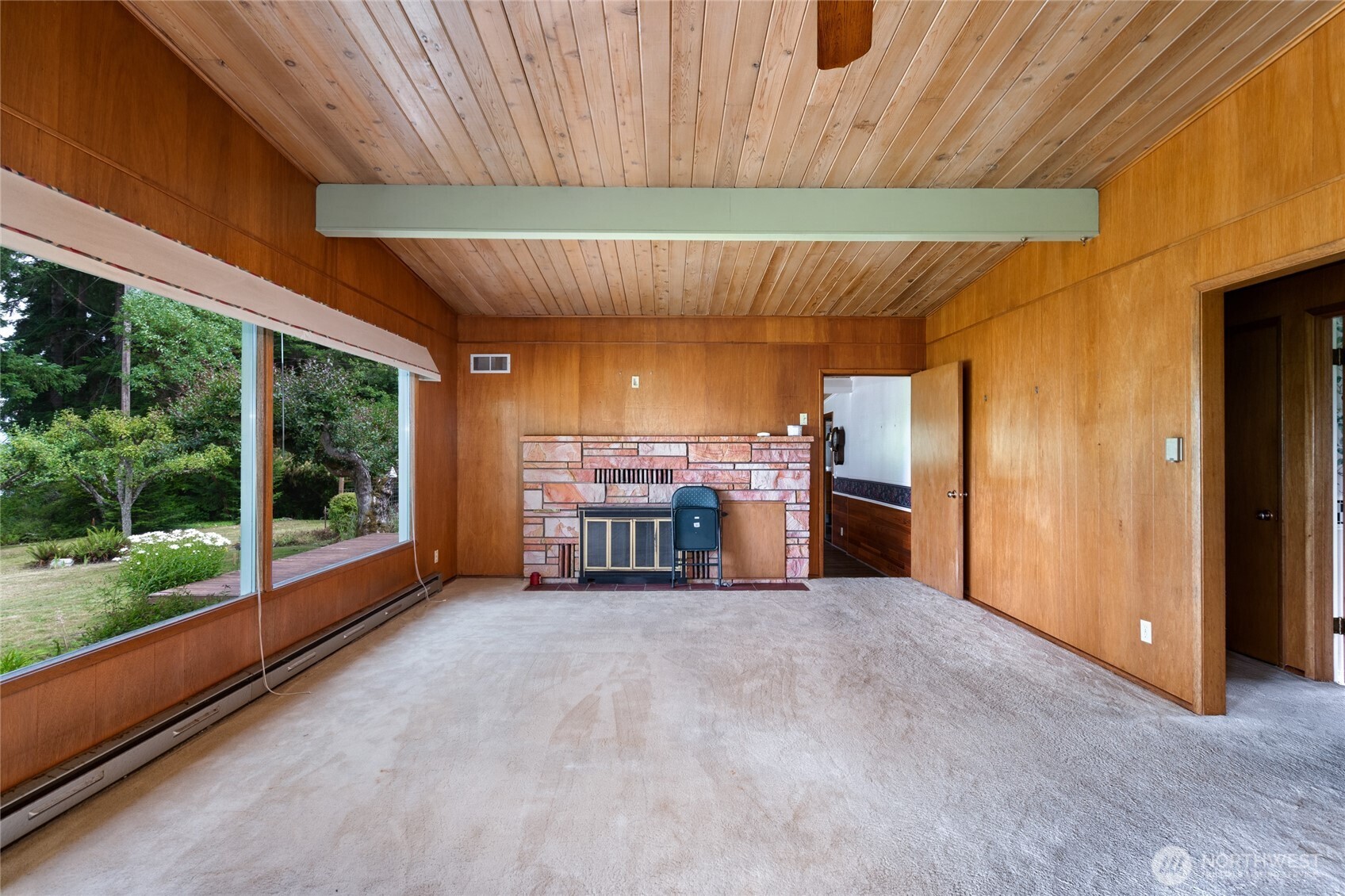 3360 Green Road Oak Harbor, WA 98277 - Photo 4 of 35 a view of a room with large windows and a table and chairs