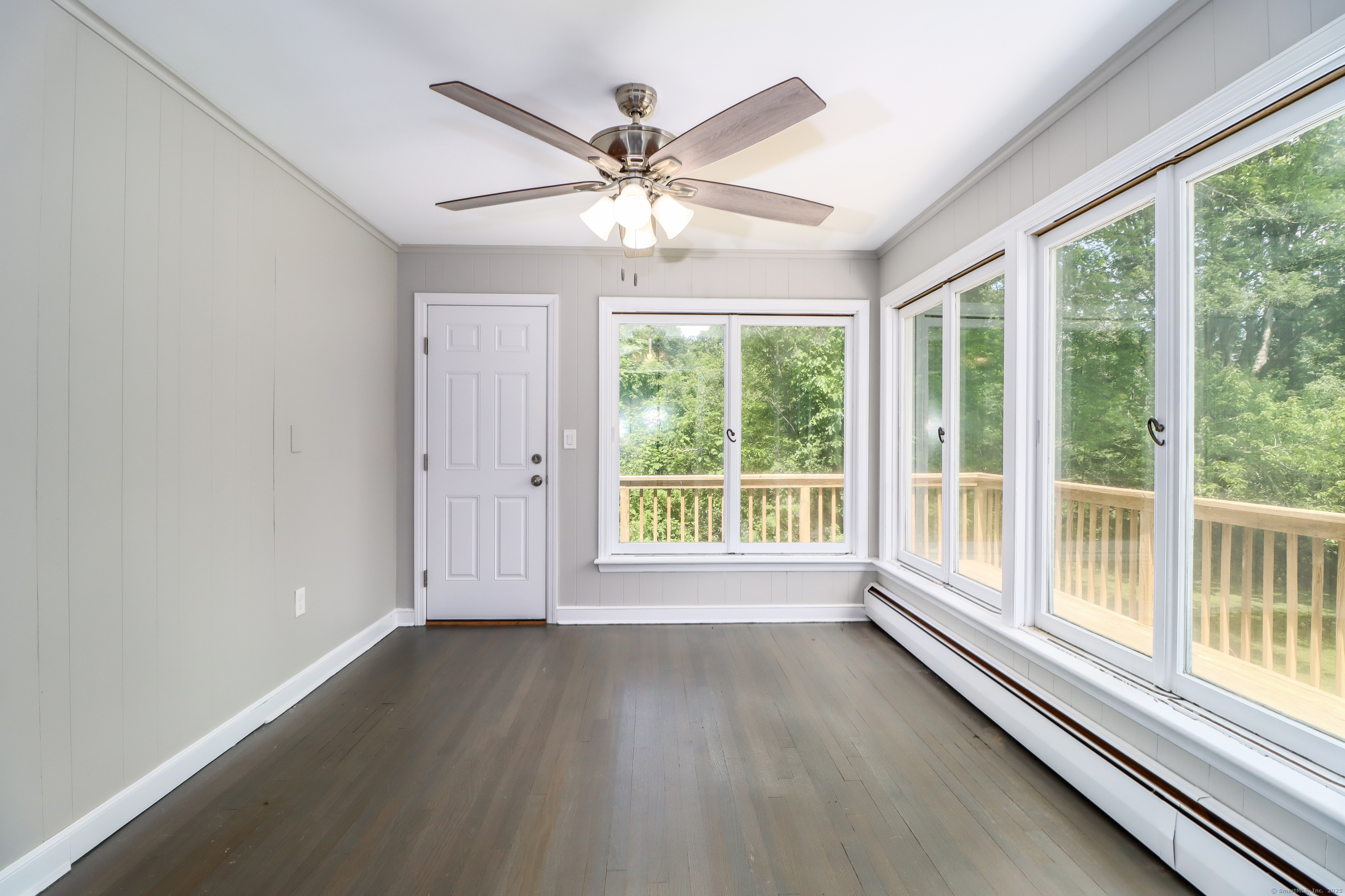 22 Lonetown Road Redding, CT 06896 - Photo 11 of 37 a view of a livingroom with a ceiling fan and a large window