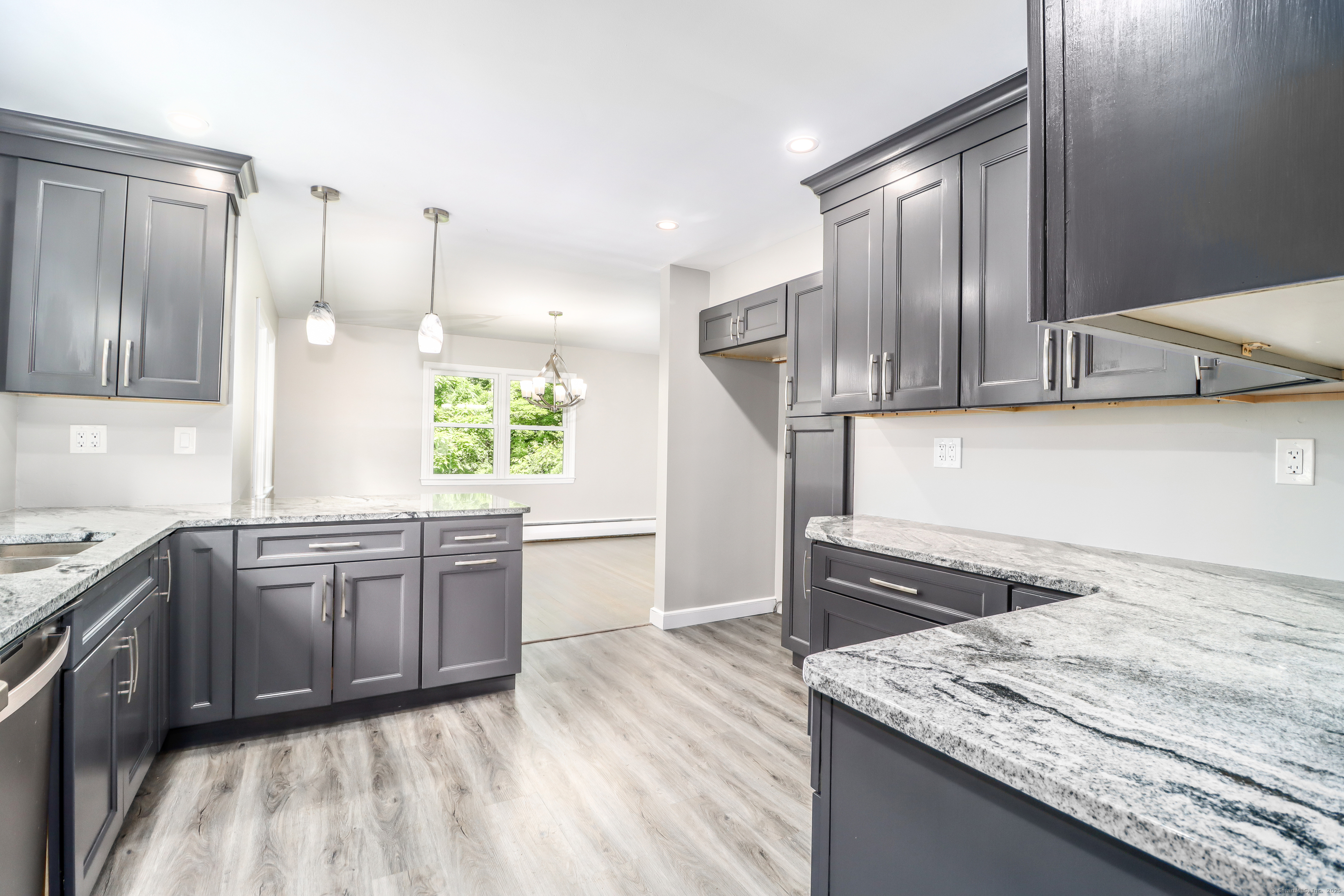 22 Lonetown Road Redding, CT 06896 - Photo 12 of 37 a kitchen with stainless steel appliances granite countertop a sink stove and refrigerator