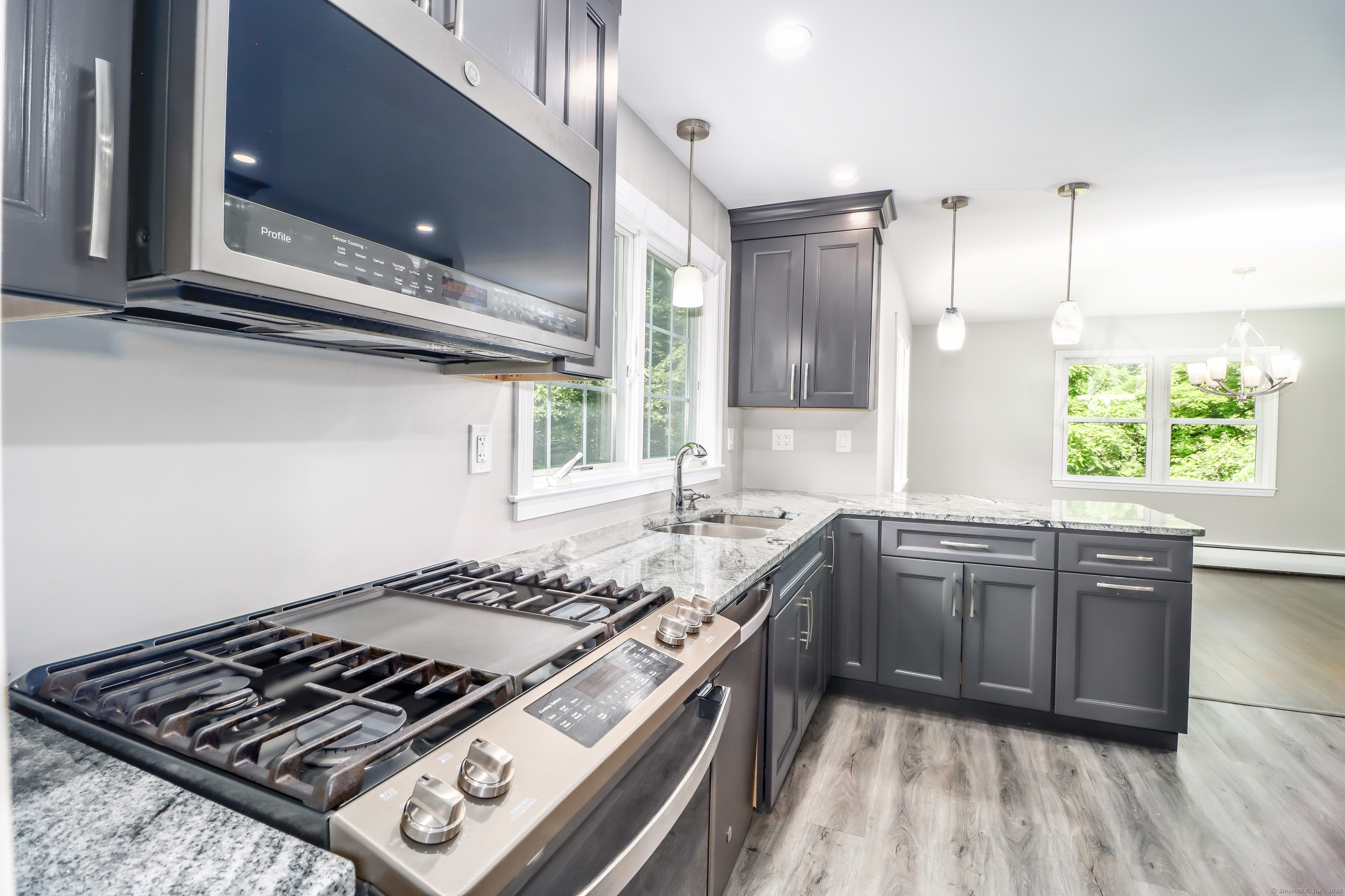 22 Lonetown Road Redding, CT 06896 - Photo 14 of 37 a kitchen with a stove and a sink