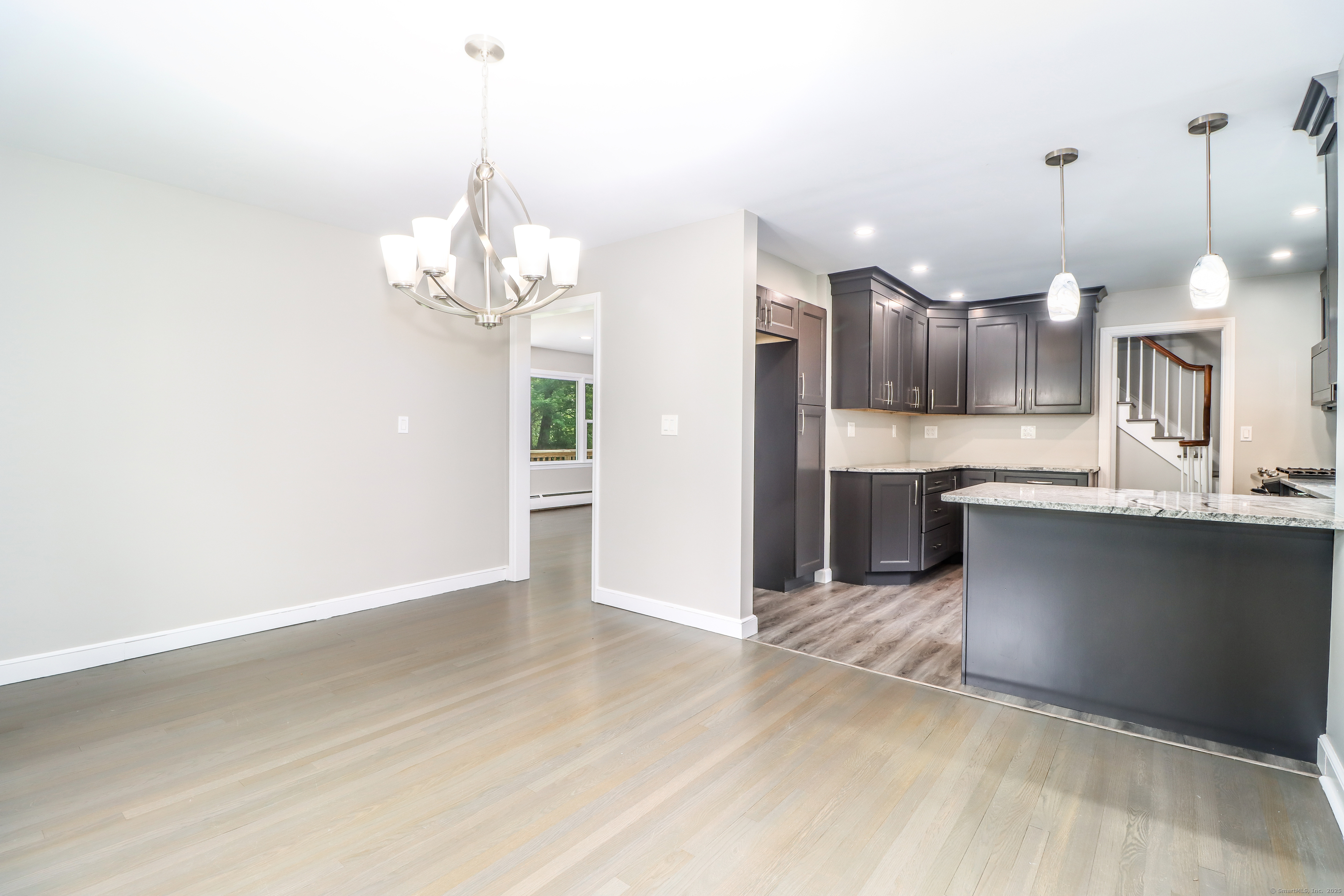 22 Lonetown Road Redding, CT 06896 - Photo 15 of 37 a kitchen with kitchen island a counter top space a sink and cabinets
