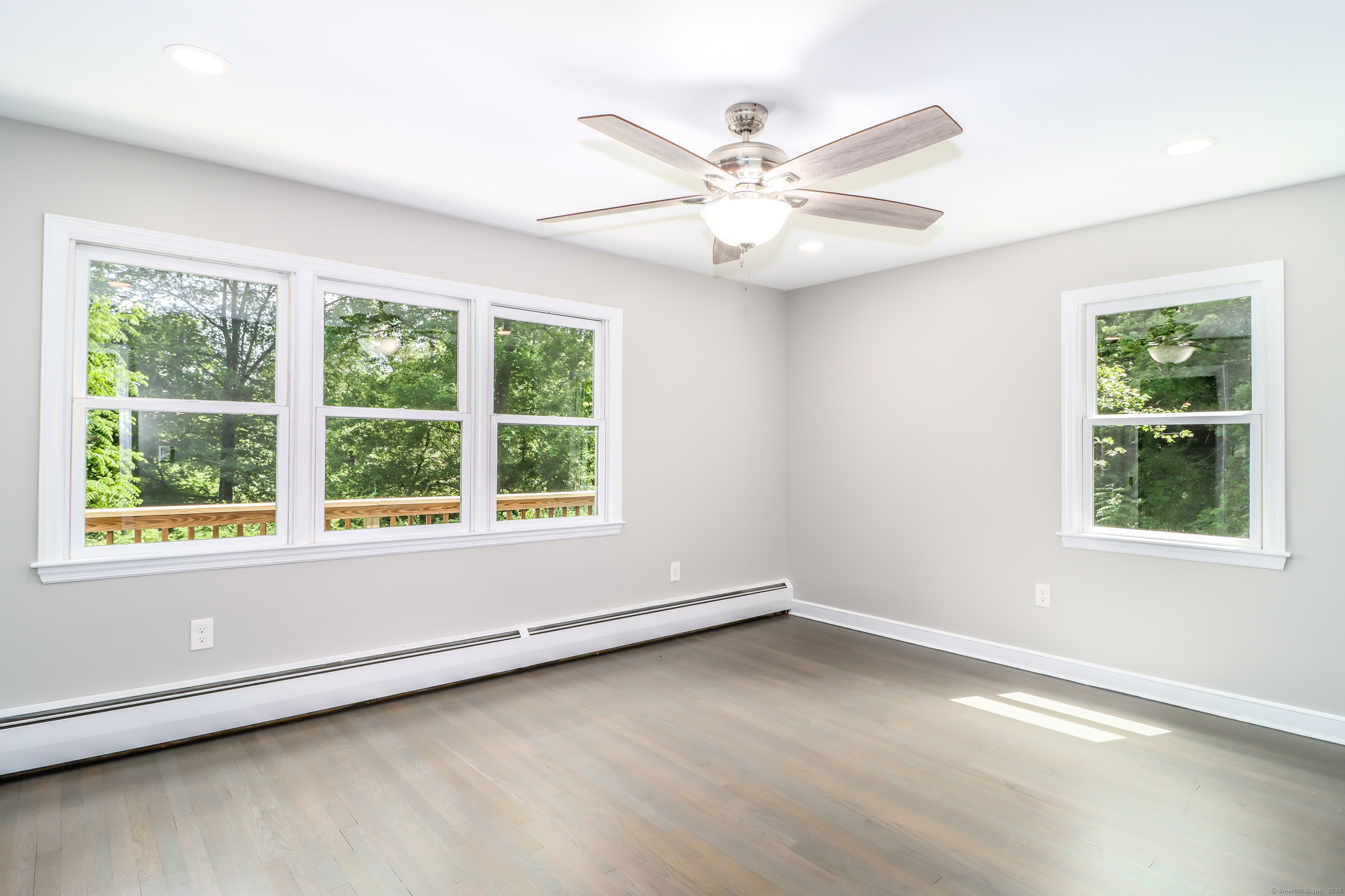 22 Lonetown Road Redding, CT 06896 - Photo 19 of 37 a view of an empty room with wooden floor and a window