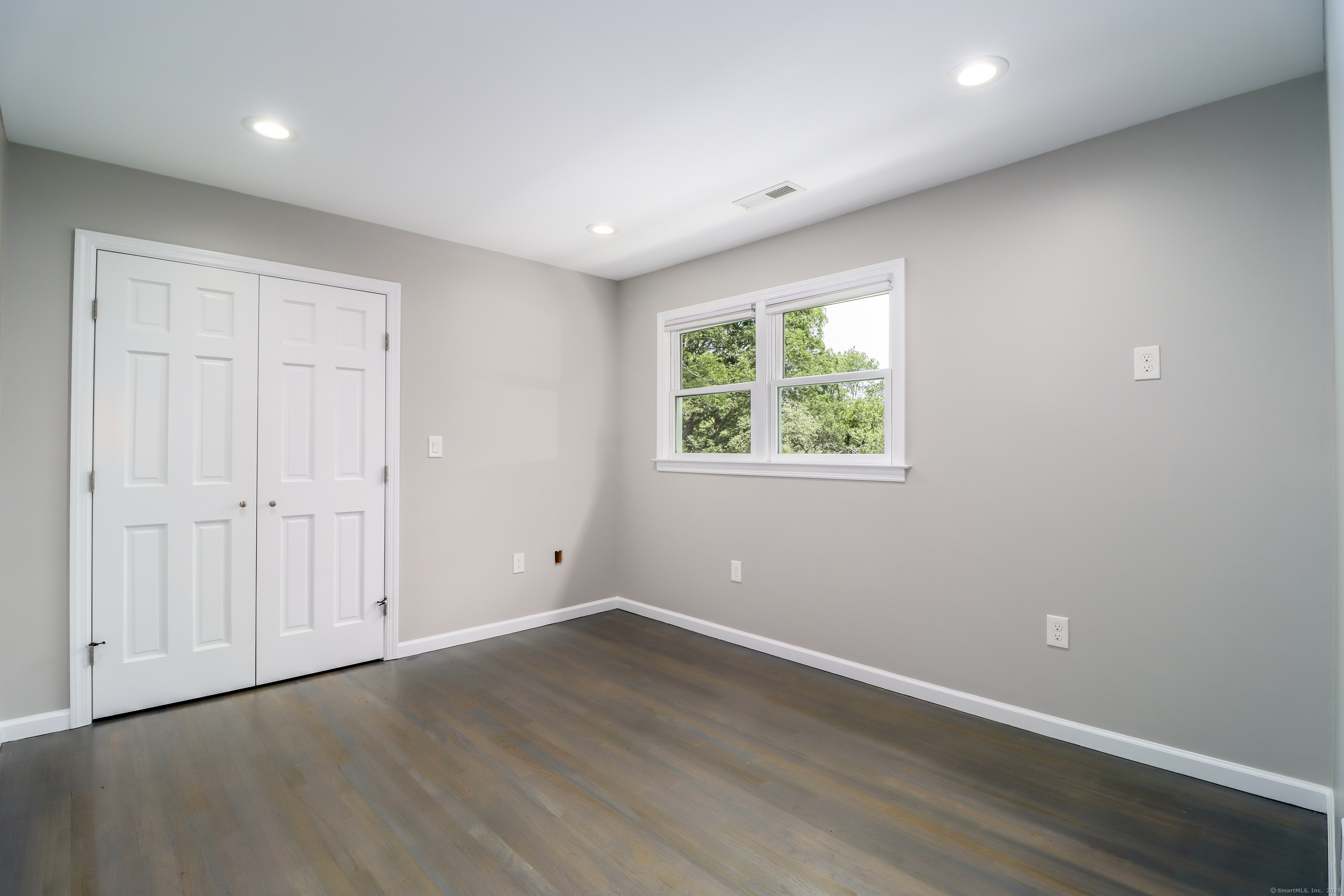 22 Lonetown Road Redding, CT 06896 - Photo 20 of 37 an empty room with wooden floor and windows