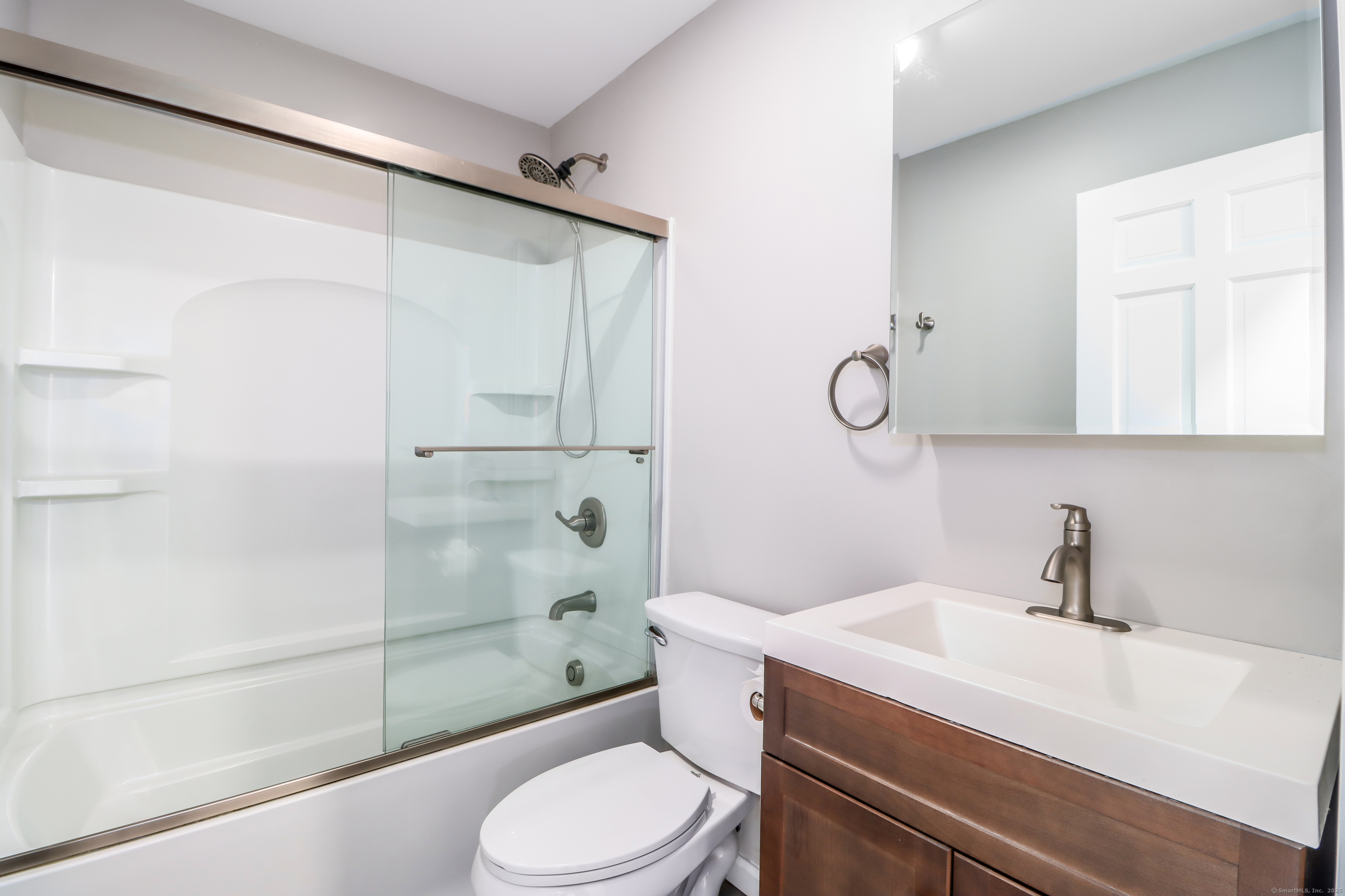 22 Lonetown Road Redding, CT 06896 - Photo 21 of 37 a bathroom with a sink a toilet and shower