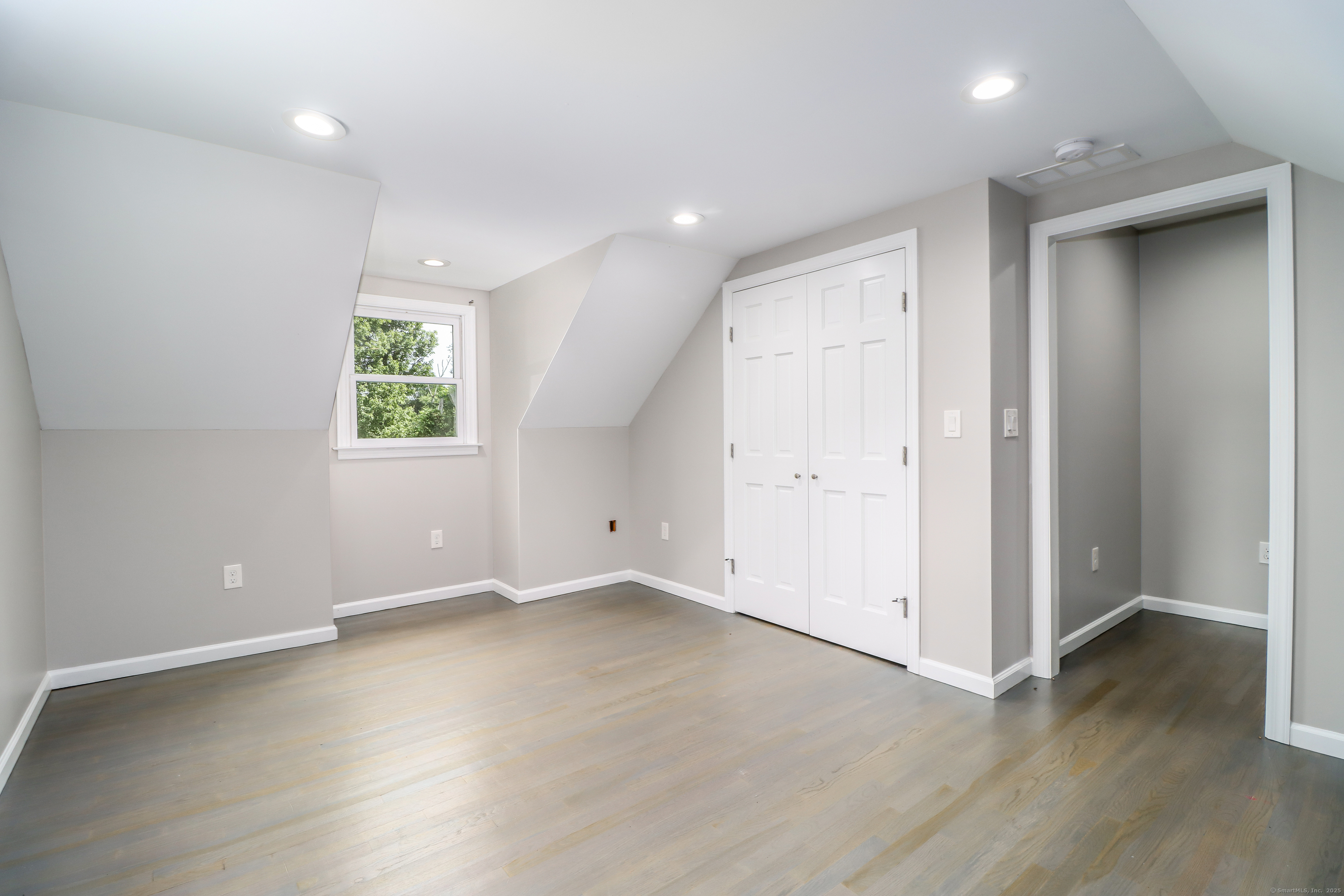 22 Lonetown Road Redding, CT 06896 - Photo 22 of 37 an empty room with wooden floor and a window