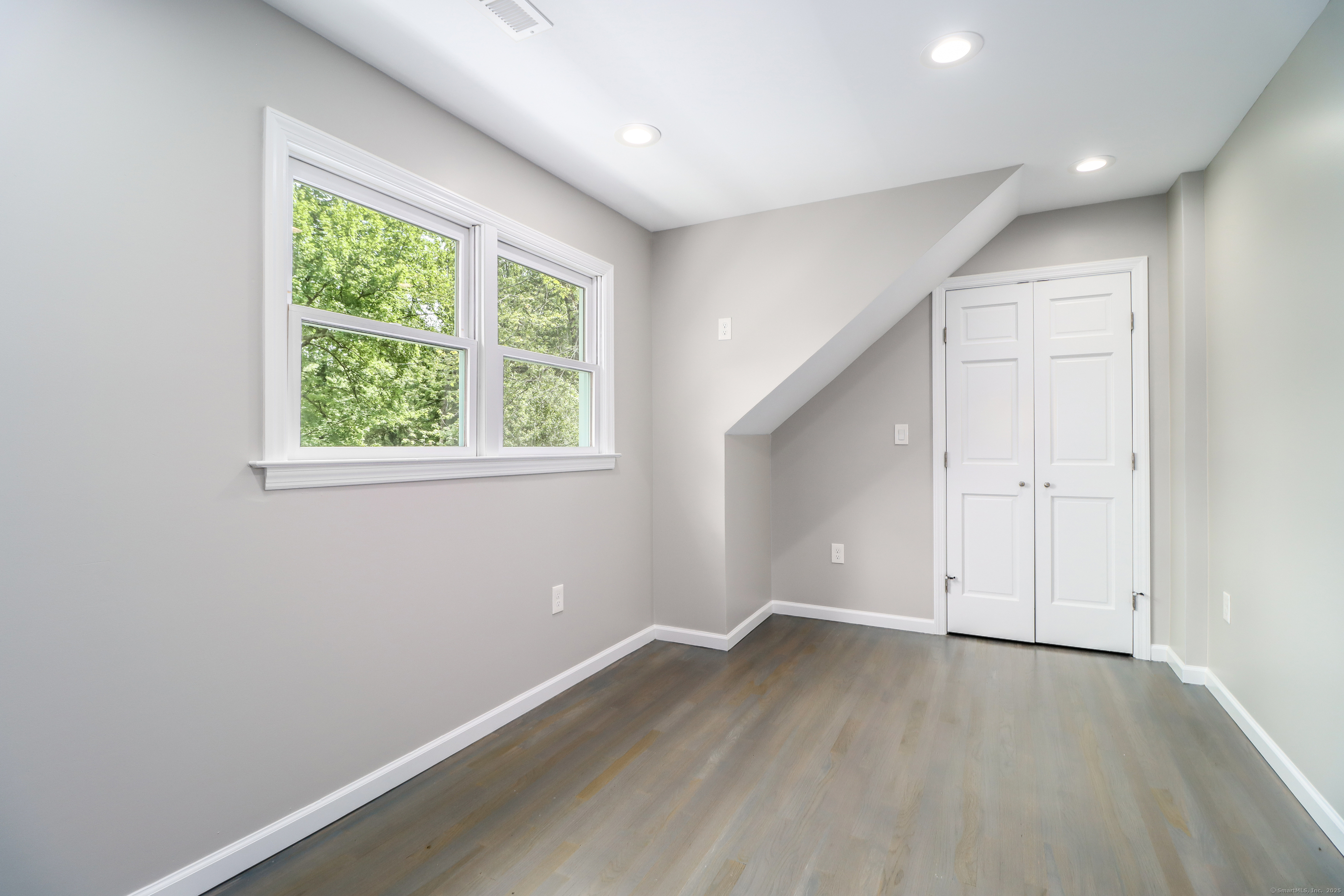 22 Lonetown Road Redding, CT 06896 - Photo 24 of 37 an empty room with wooden floor and windows