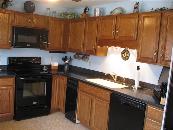 4305 Supinlick Ridge Road Mount Jackson, VA 22842 - Photo 11 of 30 a kitchen with stainless steel appliances granite countertop a sink stove and microwave