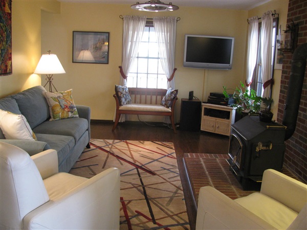 4305 Supinlick Ridge Road Mount Jackson, VA 22842 - Photo 7 of 30 a living room with furniture a flat screen tv and a window
