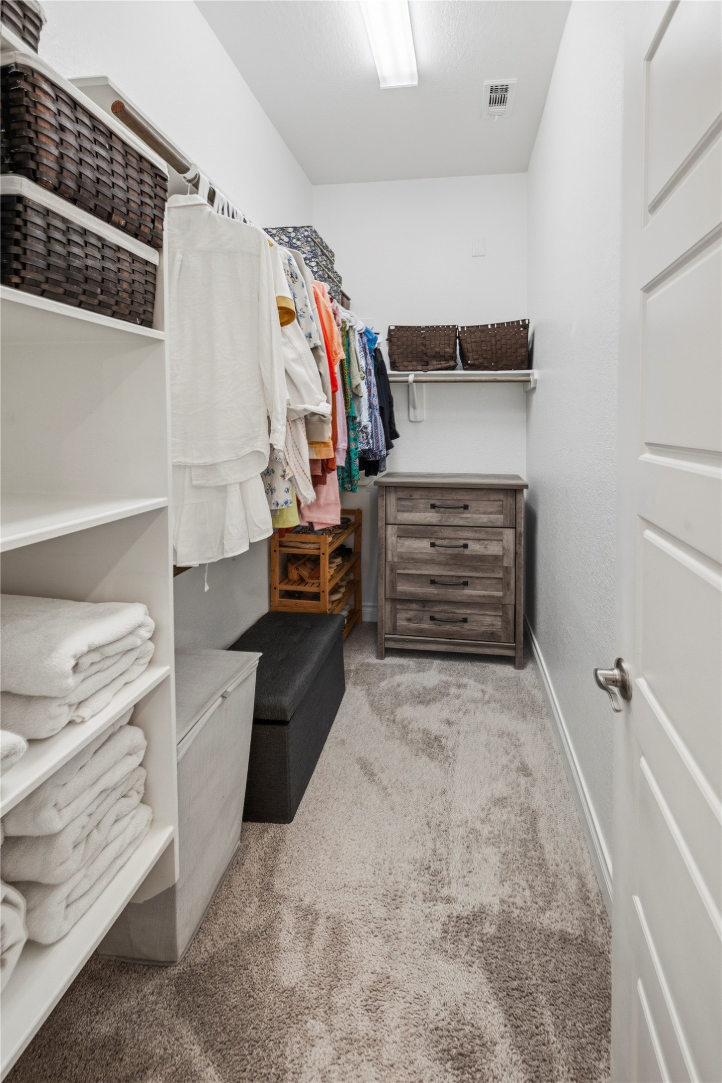 140 Catani Loop Georgetown, TX 78628 - Photo 32 of 36 Functional custom built-in shelving and ample hanging space create an organized personal sanctuary.