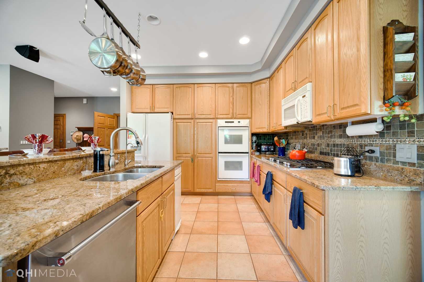 618 Hillside Road Glenview, IL 60025 - Photo 10 of 44 a kitchen with stainless steel appliances granite countertop a sink a counter space and a window
