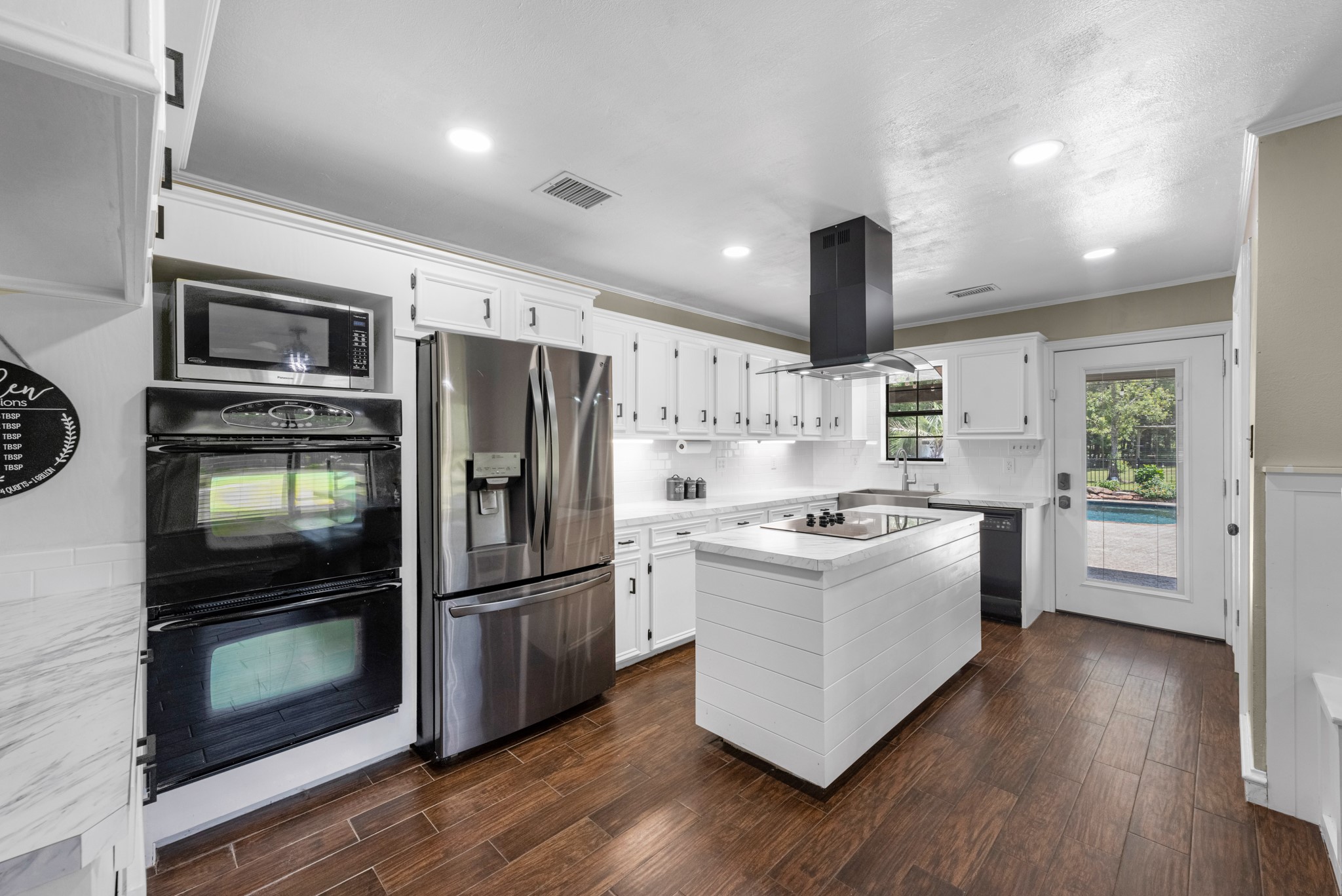 22698 Brook Forest Road New Caney, TX 77357 - Photo 9 of 46 Recently remodeled kitchen with bright cabinetry, stainless appliances & generous prep space!