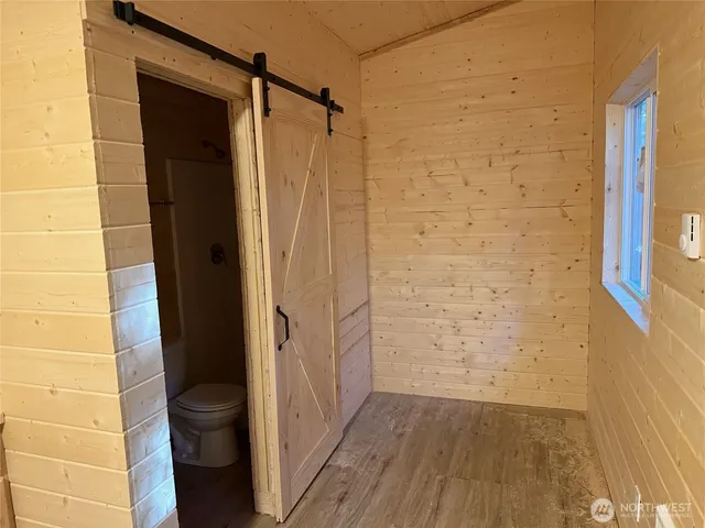 a bathroom with a shower and a toilet
