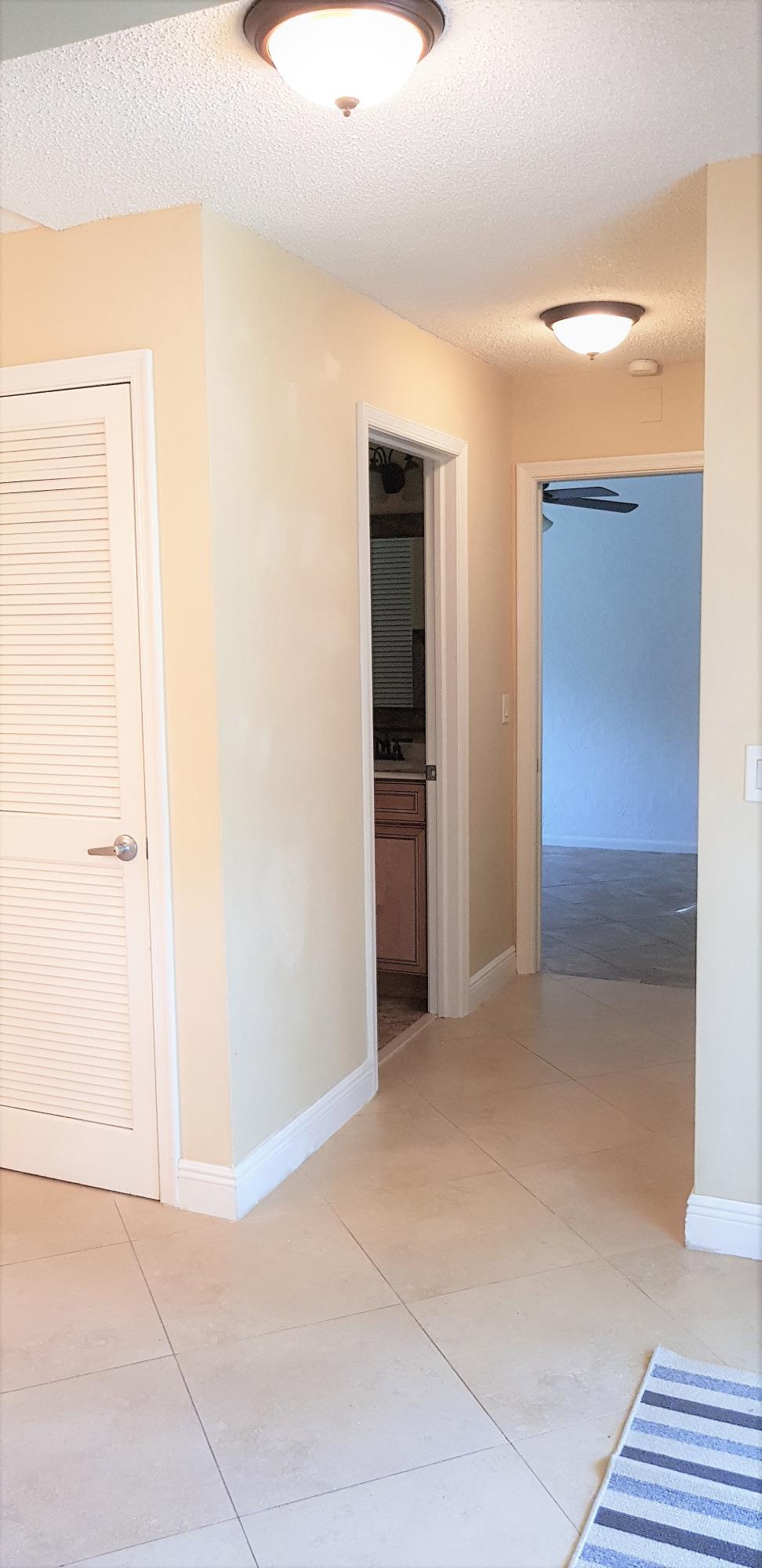 23344 Southwest 55th Way, Unit B Boca Raton, FL 33433 - Photo 14 of 40 Hallway to Laundry Bath & 2nd Bedroom