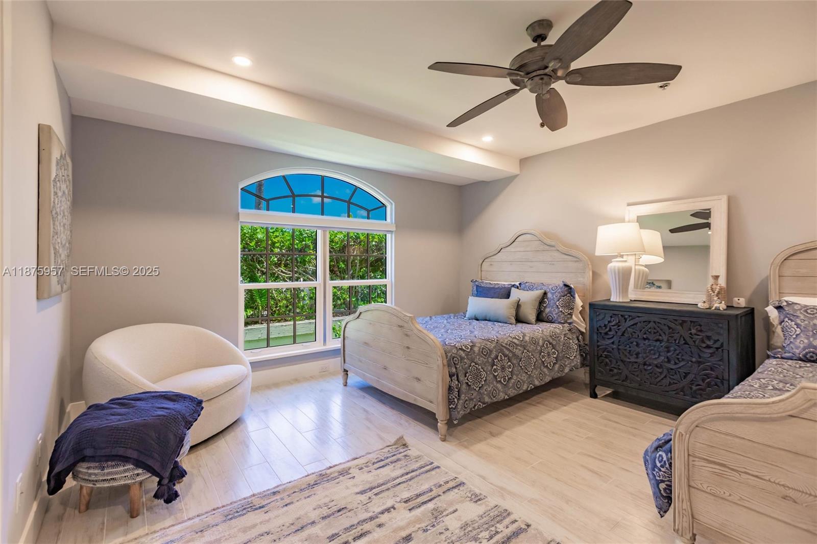 117 Ocean Key Way Jupiter, FL 33477 - Photo 21 of 58 a bedroom with two beds and a large window