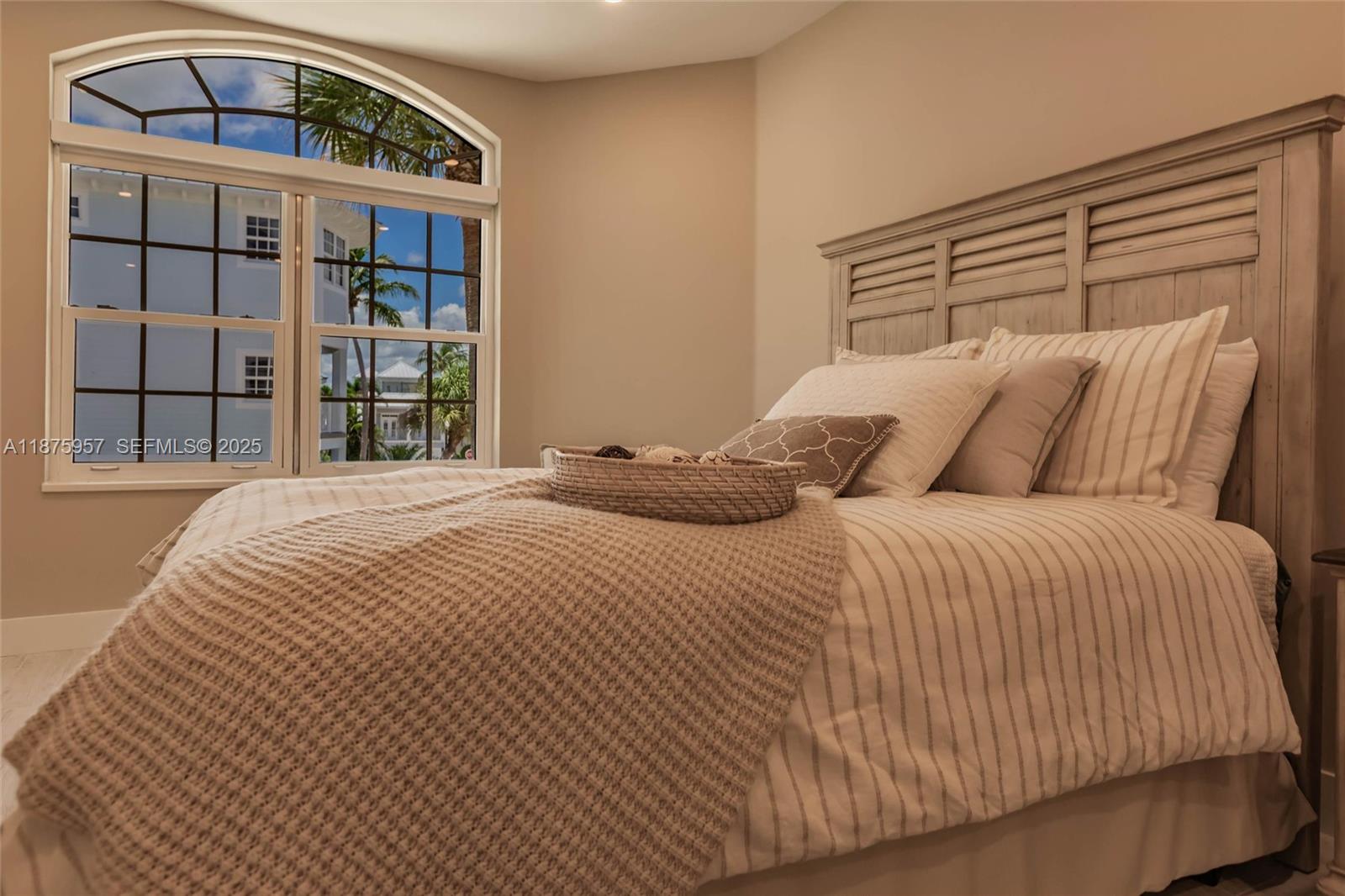 117 Ocean Key Way Jupiter, FL 33477 - Photo 29 of 58 a bedroom with a large bed and a window
