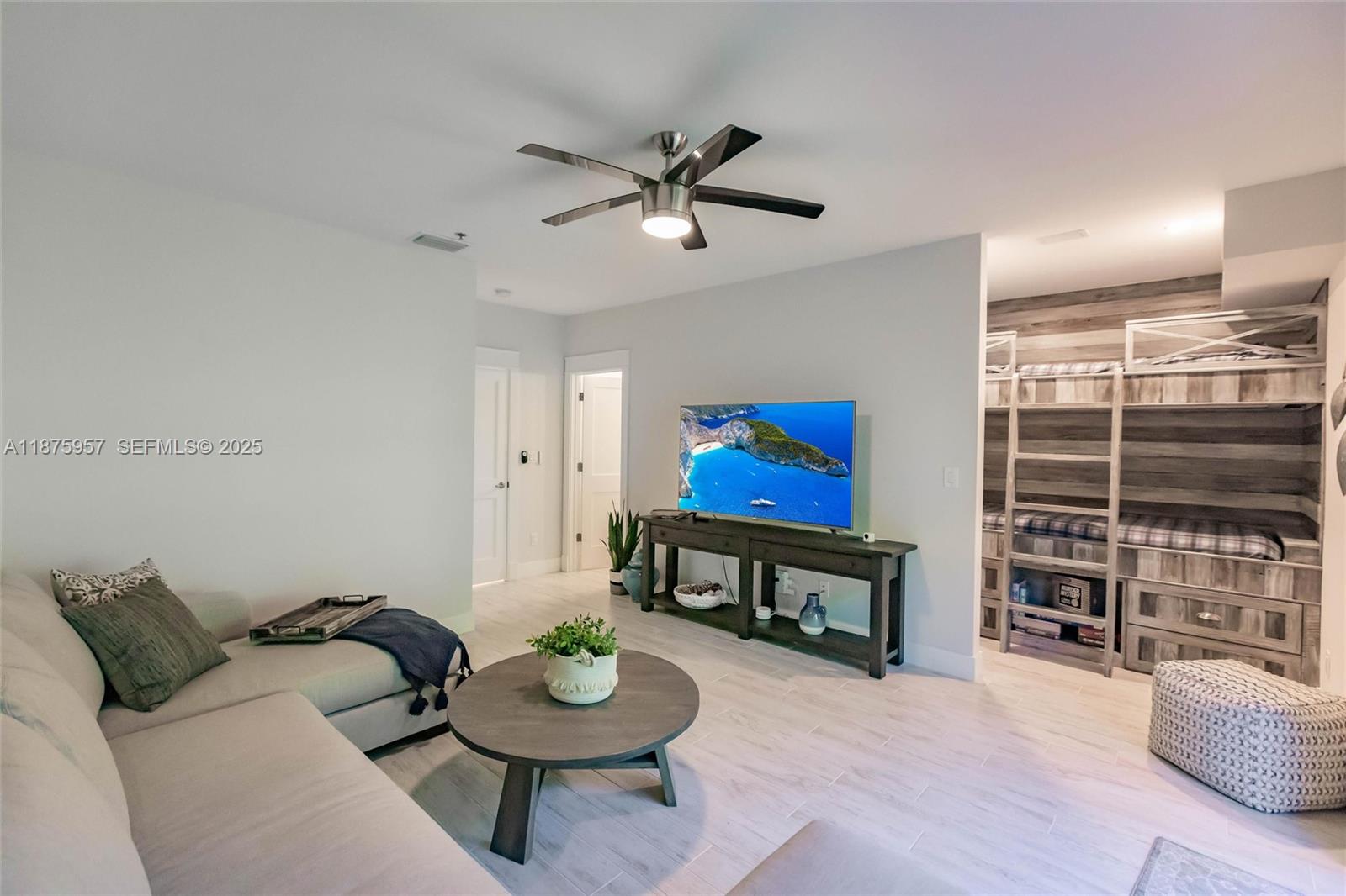 117 Ocean Key Way Jupiter, FL 33477 - Photo 33 of 58 a living room with furniture and a wooden floor